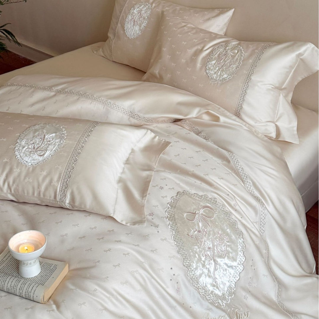 Luxurious cotton satin bedding set with embroidered medallion appliqués and lace trim