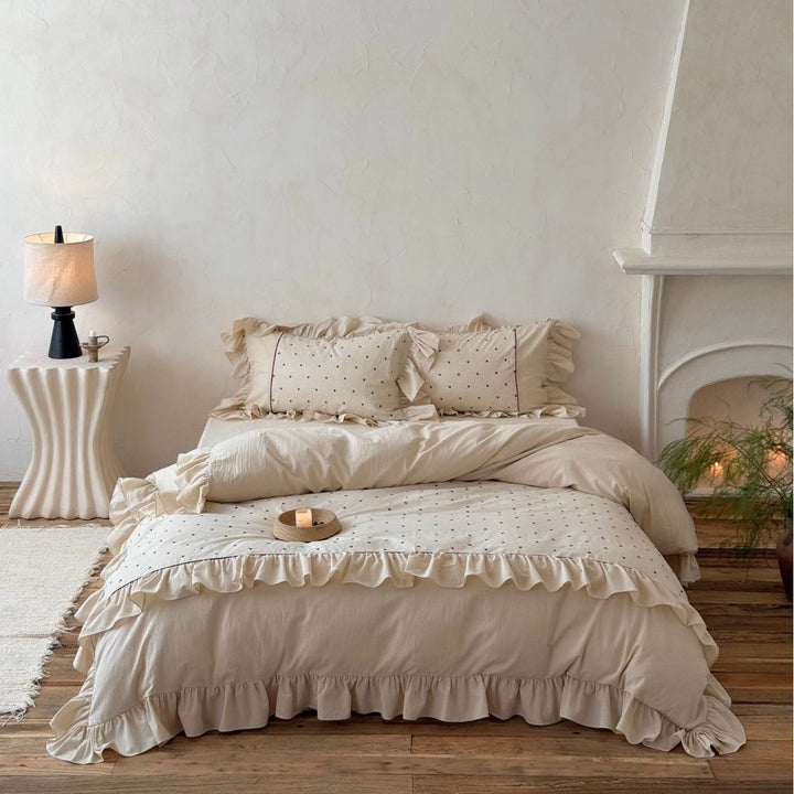 Romantic bedding set with ruffles and delicate dot embroidery