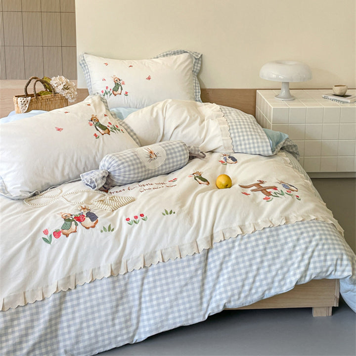 Romantic bedding set with embroidered rabbit motifs and delicate ruffles