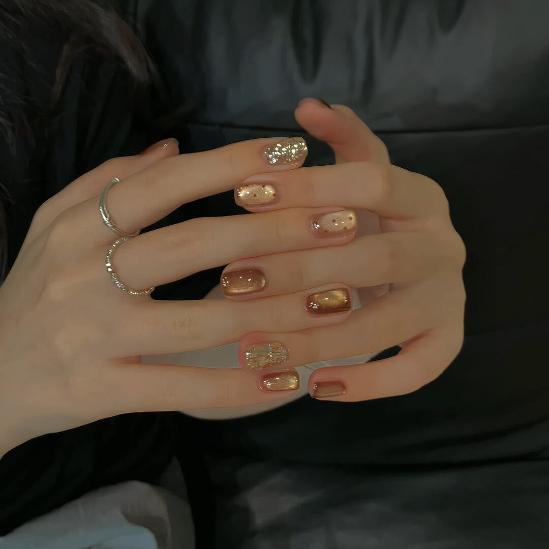 Elegant artificial nails with shimmering effects and sparkling accents Stornfield