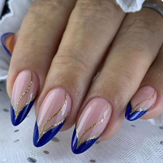 Artistic Nail Design with Elegant Golden Accents Stornfield