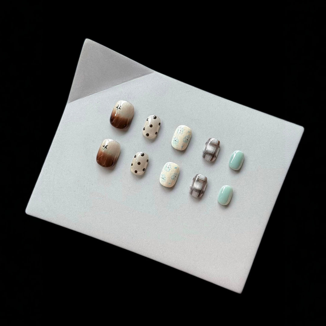 Artistic Press-On Nail Art Set with Elegant Floral and Polka Dot Designs