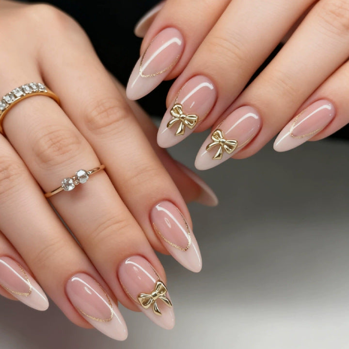 Creative Stiletto Nail Set with Gold Accents and Transparent Finish Stornfield