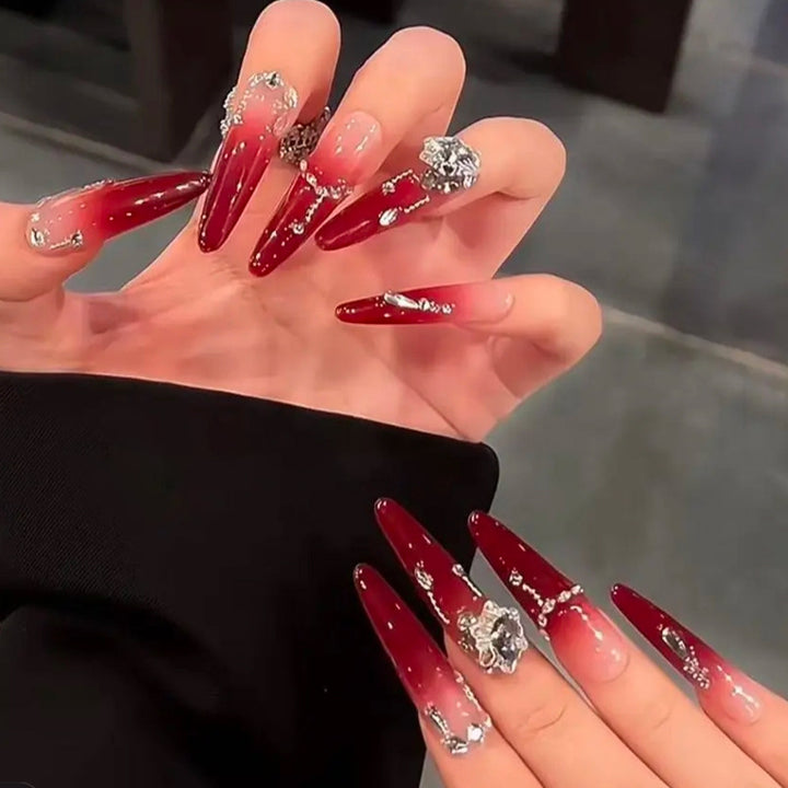 Artificial nails with elegant glitter and jewelry accents Stornfield
