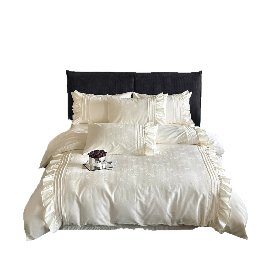 Luxurious satin bedding set with ruffles and delicate floral embroidery