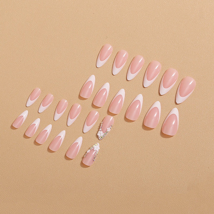 Artificial nails with elegant French tips and rhinestone details Stornfield