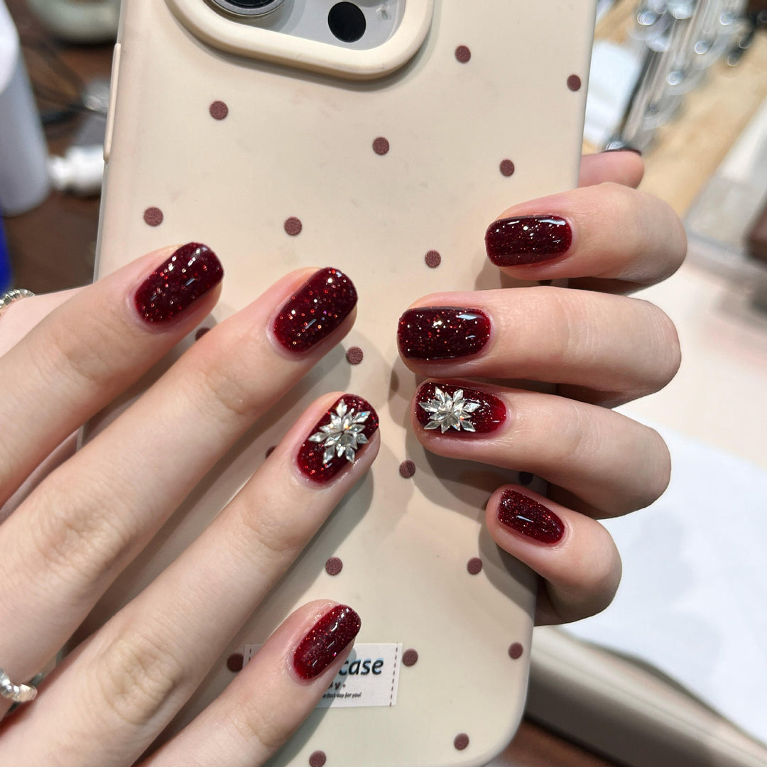 Glamorous artificial nails with rhinestone applications Stornfield