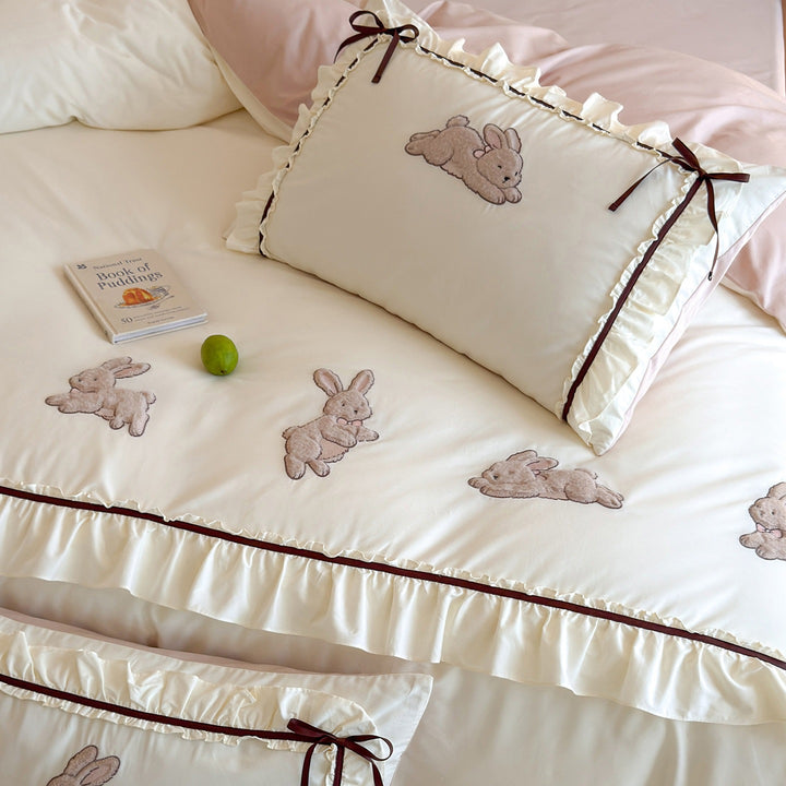 Romantic duvet cover set with embroidered bunnies, ruffled edge and reversible function