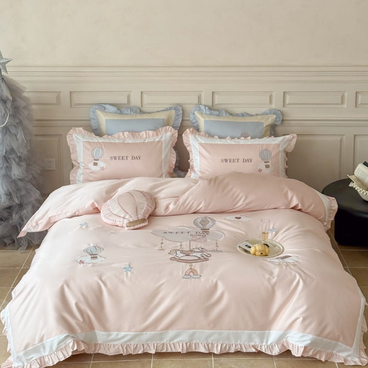 Bedding set in vintage girl style with ruffled hem, hot air balloon applique, and extra soft satin