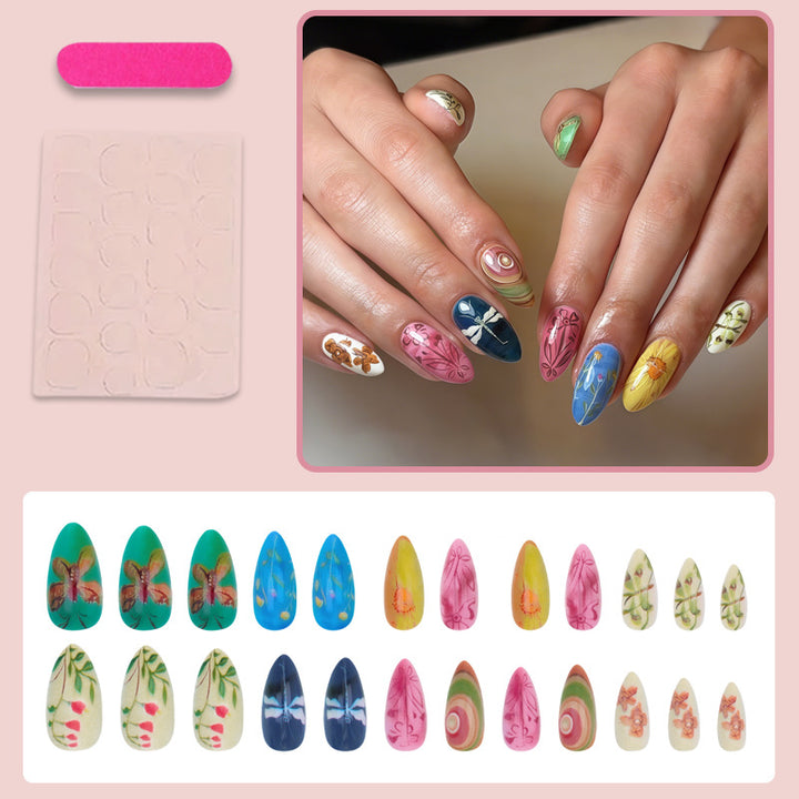 Nail art set with creative hand-painted designs and elegant details Stornfield