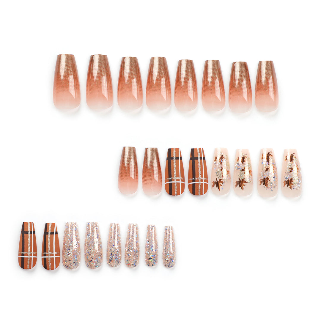 Artful nail extensions with glitter and leaf patterns Stornfield