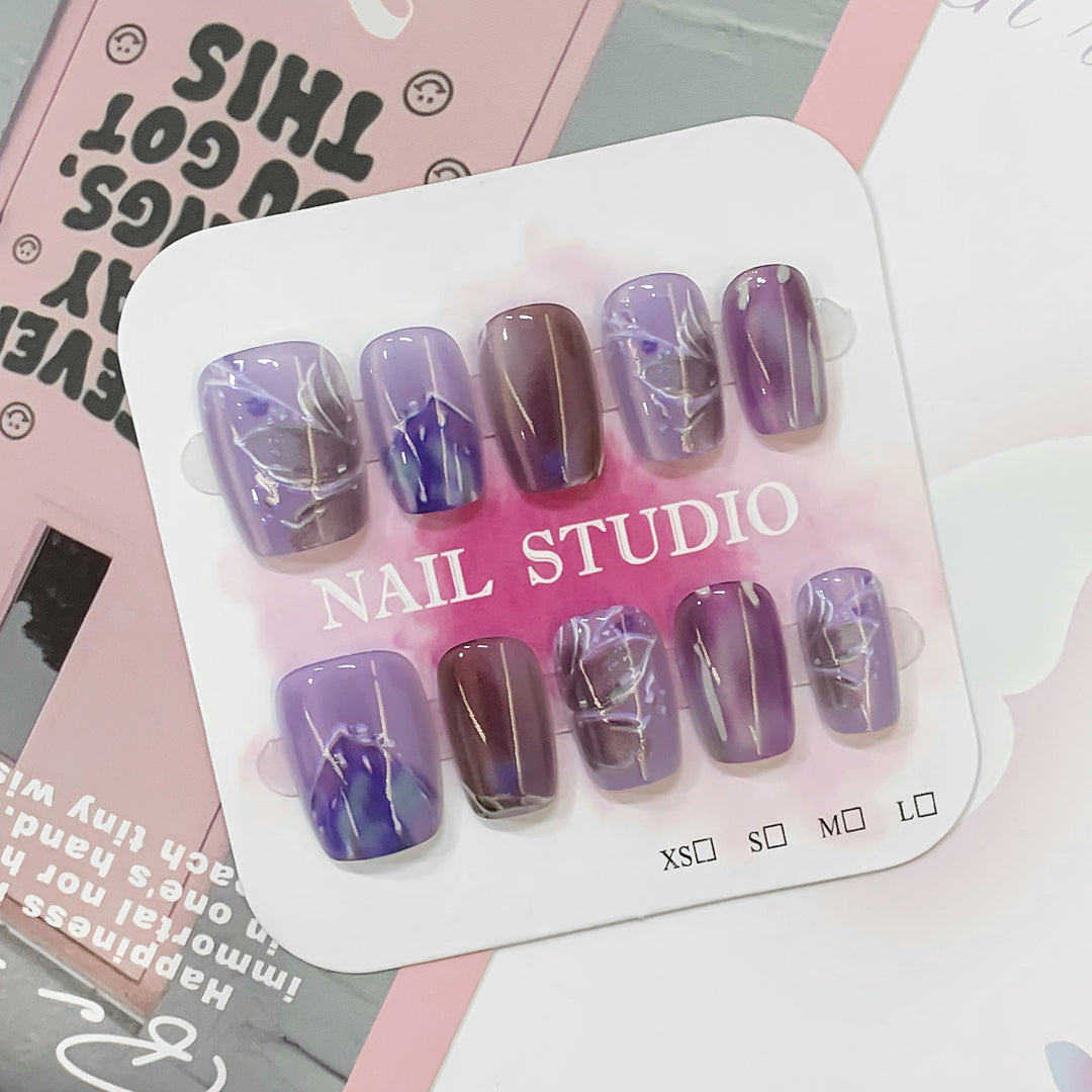 Artful acrylic nails with marbled design Stornfield