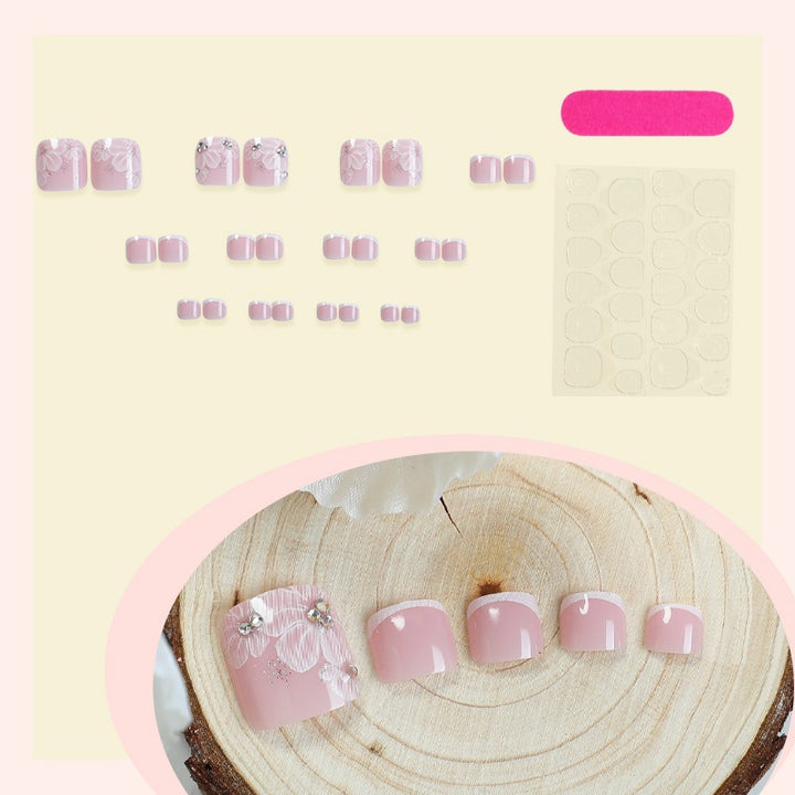 Nail art set with delicate floral design and glitter accents Stornfield