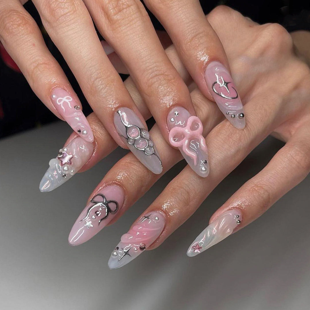 Artful stiletto nails in an elegant design with creative embellishments Stornfield