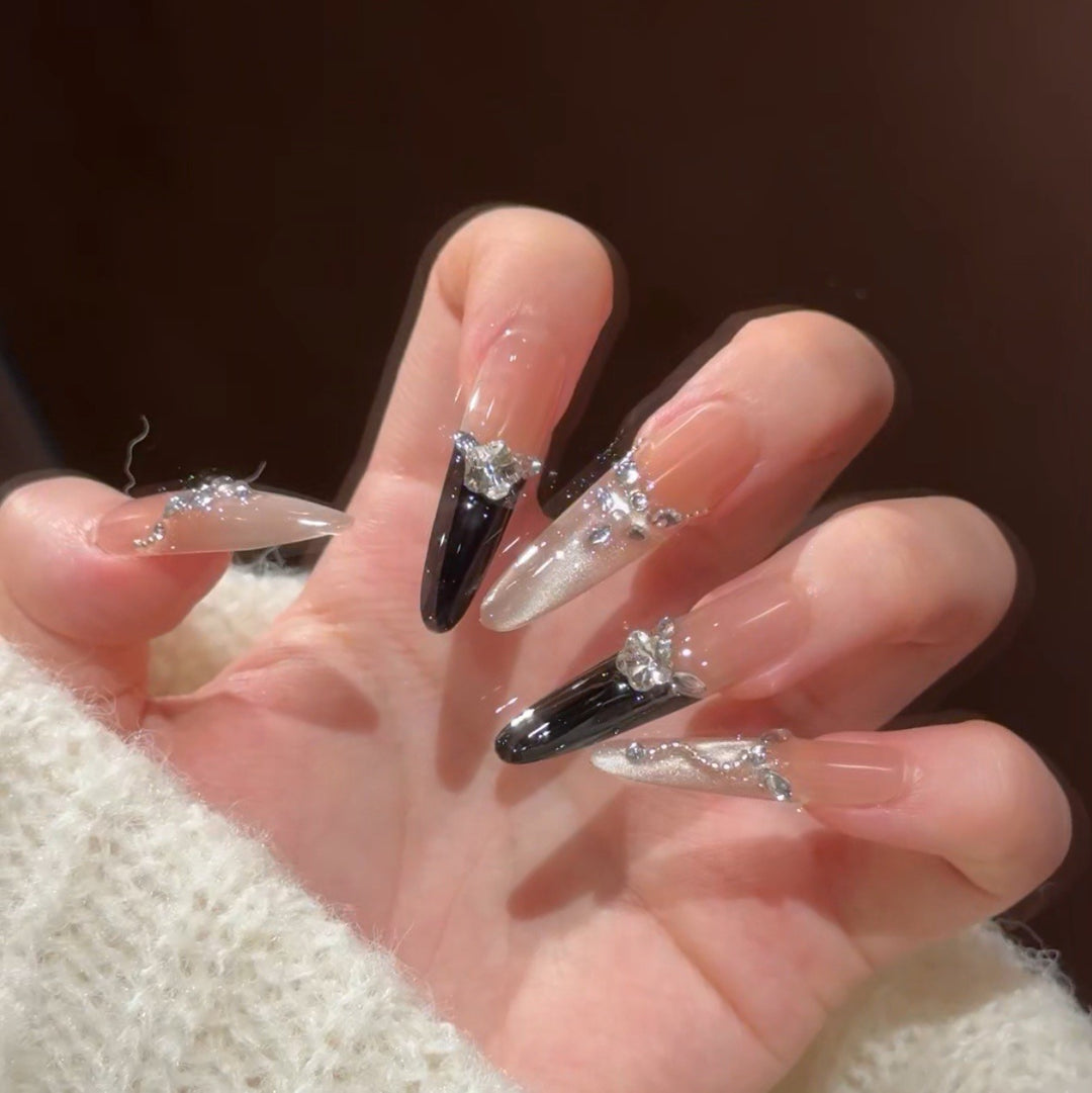 Artistic Stiletto Press-On Nail Art with Glimmering Accents Stornfield