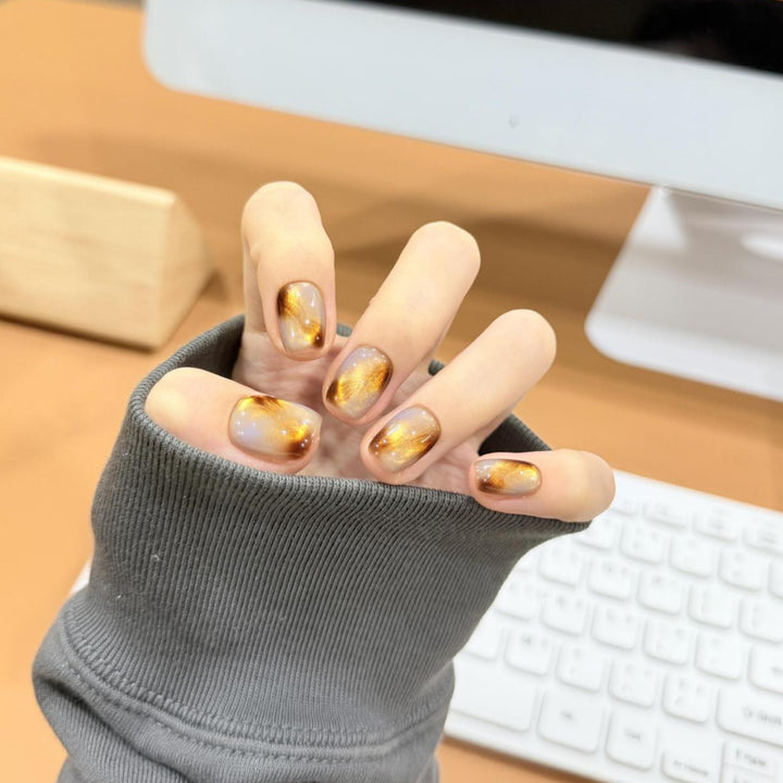 Artificial nails with noble metallic design Stornfield