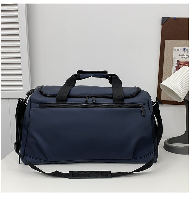 Sporty travel bag with reinforced carrying handles and multiple compartments Stornfield