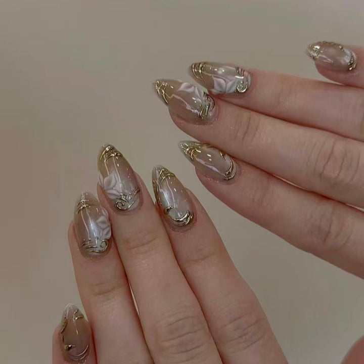 Elegant artificial nails with marble and gold accents Stornfield