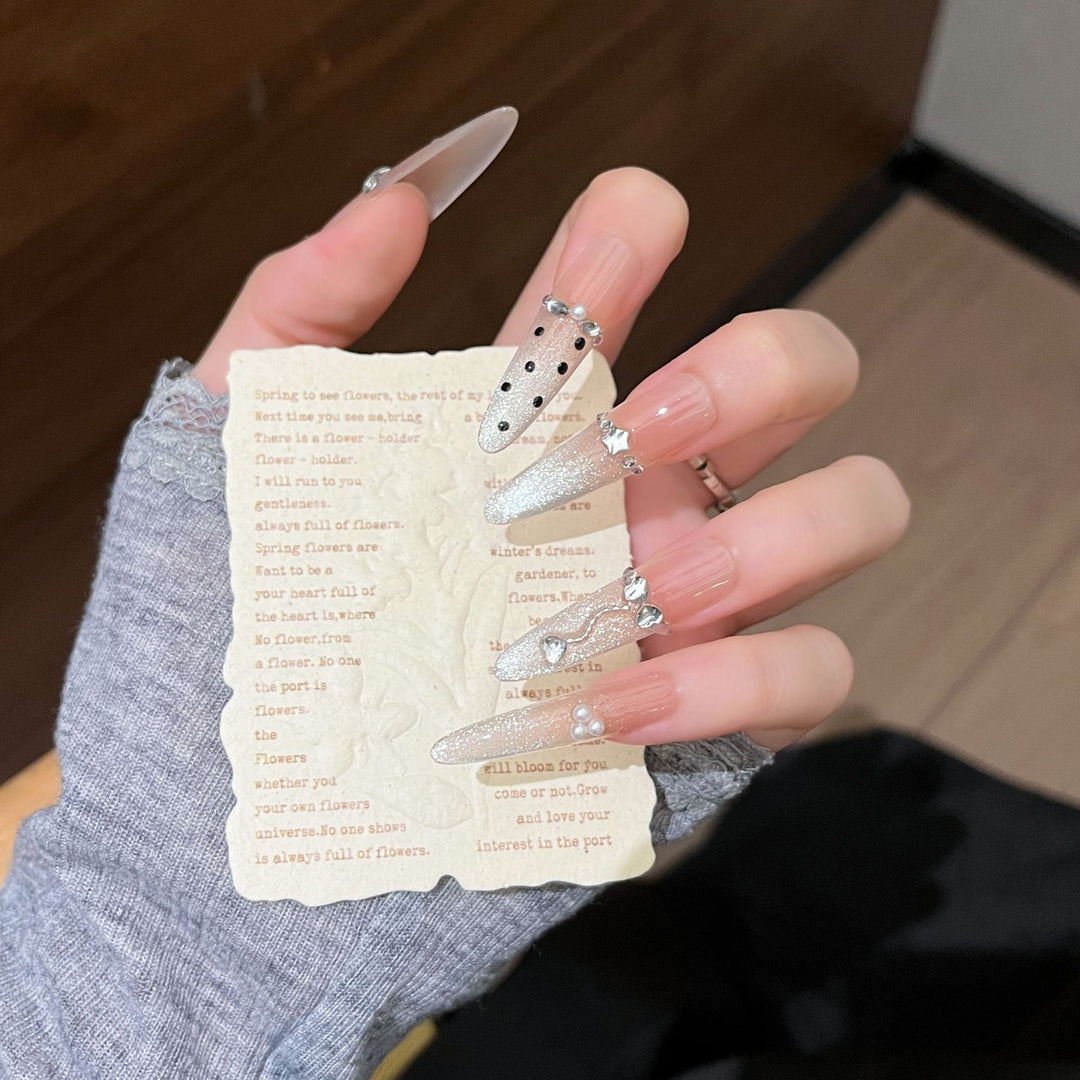 Artistic Stiletto Press-On Nail Art with Glimmering Accents Stornfield