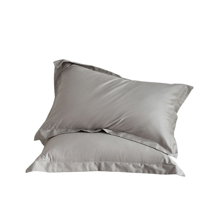 Premium pillowcase and fitted sheet set made of cotton percale with hotel edge