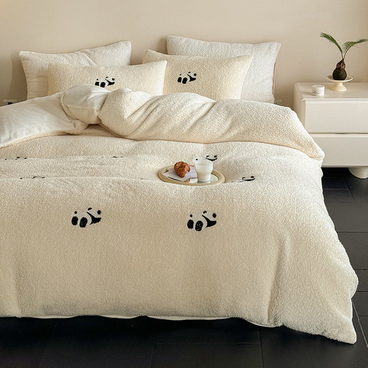 Cozy sherpa bedding set with embroidered penguin motifs and reversible function