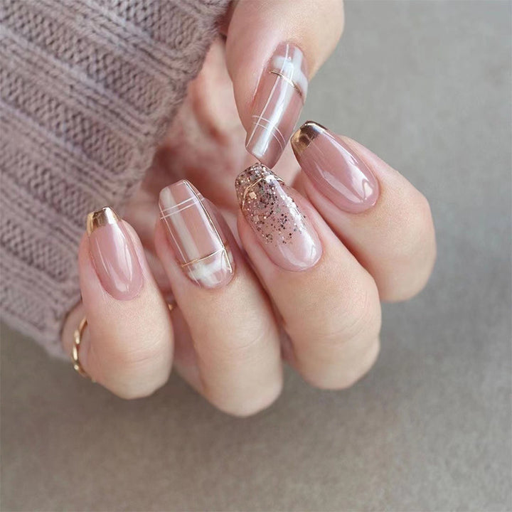Artistic Nail Extensions with Glitter and Gold Accents Stornfield