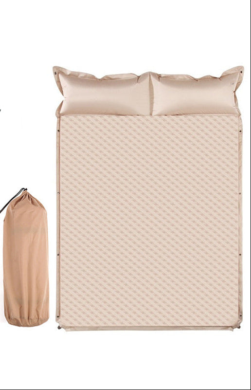 double connectable inflatable camping mattress with integrated dual pillows, egg-crate comfort surface and compact carry sack Stornfield