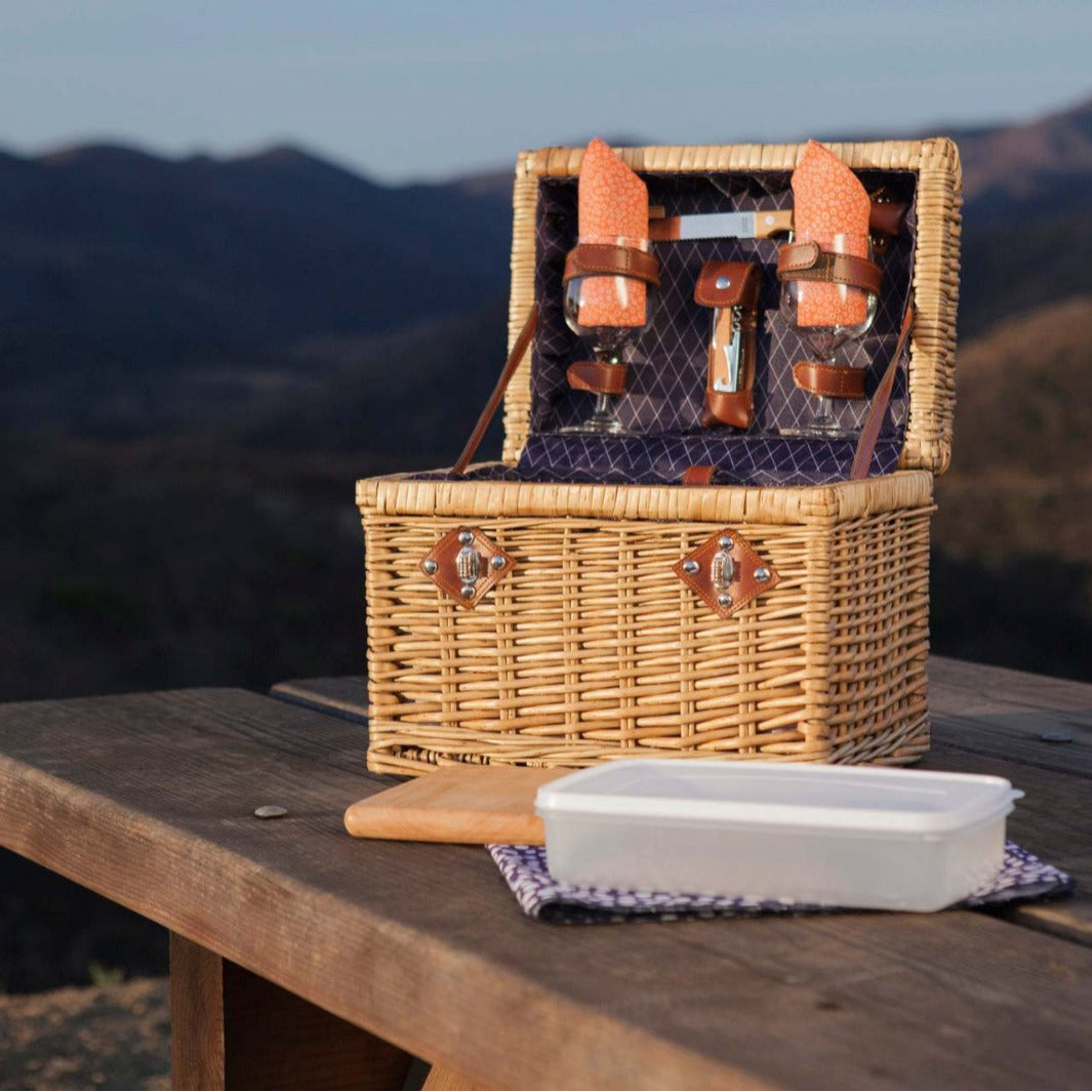 Ladies picnic basket with stylish glasses and wooden boards Stornfield