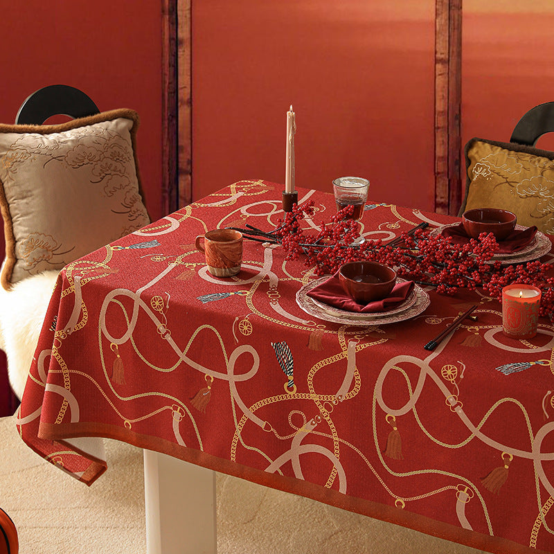 Rectangular tablecloth made of easy-care polyester blend fabric with decorative tassel and ribbon motif and contrasted hem
