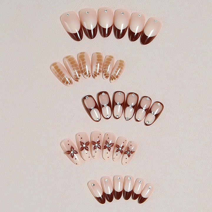 Artificial nails with elegant motif designs Stornfield