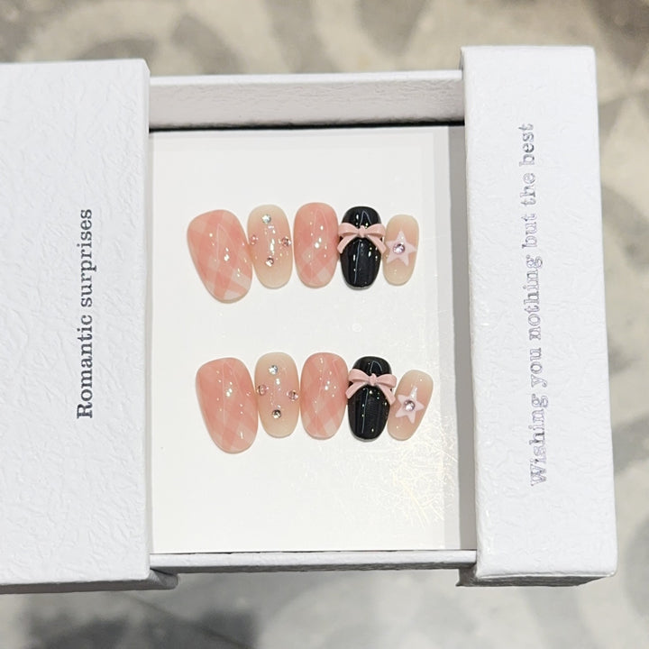 Artificial nails with romantic design and glitter details Stornfield