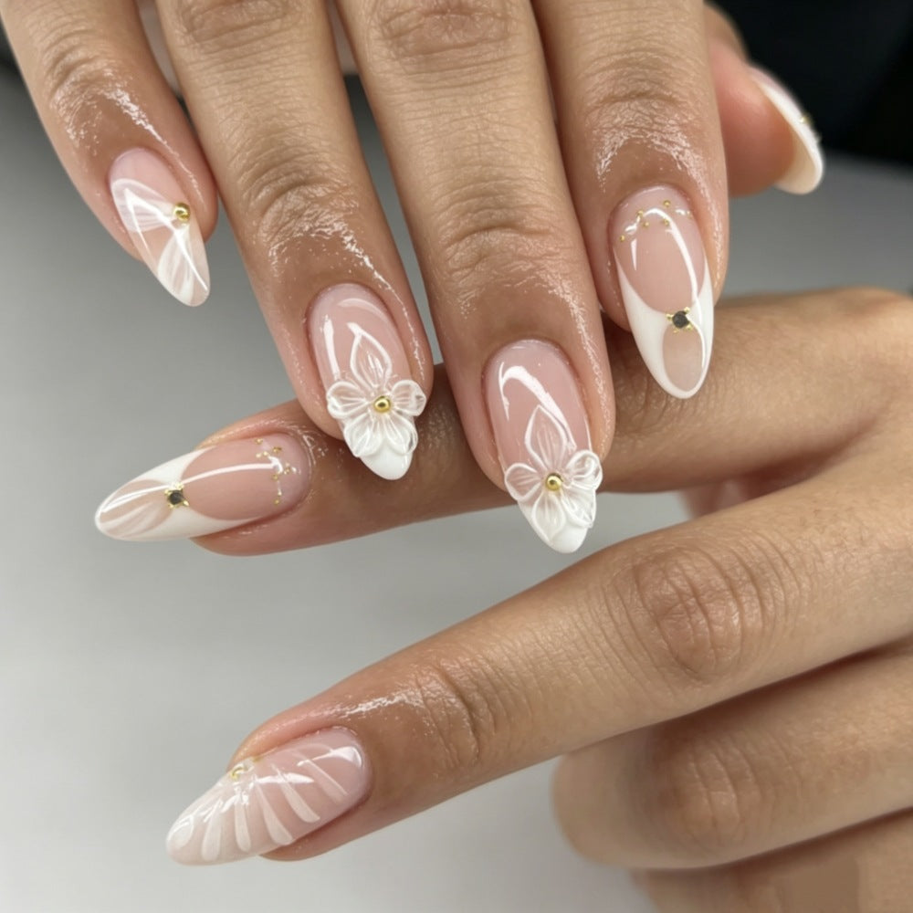 Artificial nails with elegant flower design and glitter accents Stornfield