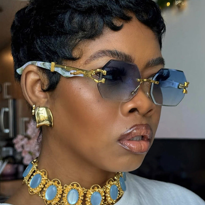 Women's fashionable sunglasses with extravagant octagonal design and golden accents Stornfield