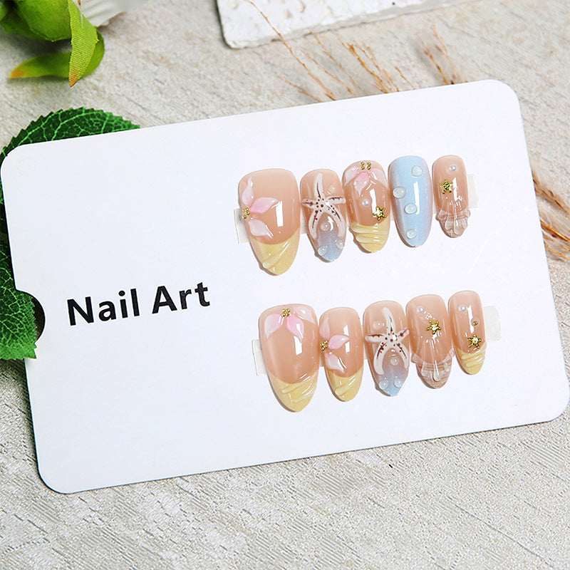 Artificial nails with floral motifs and glitter details Stornfield