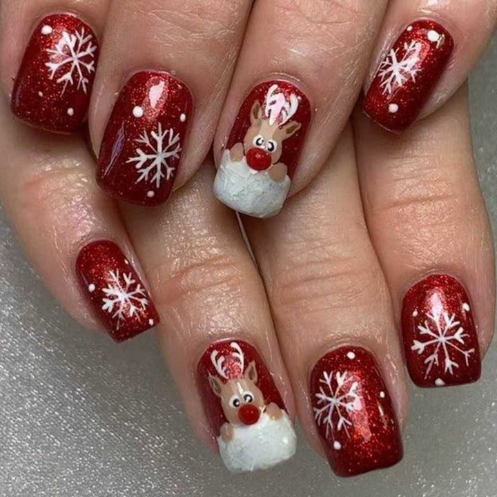 Creative artificial nails with festive reindeer design Stornfield