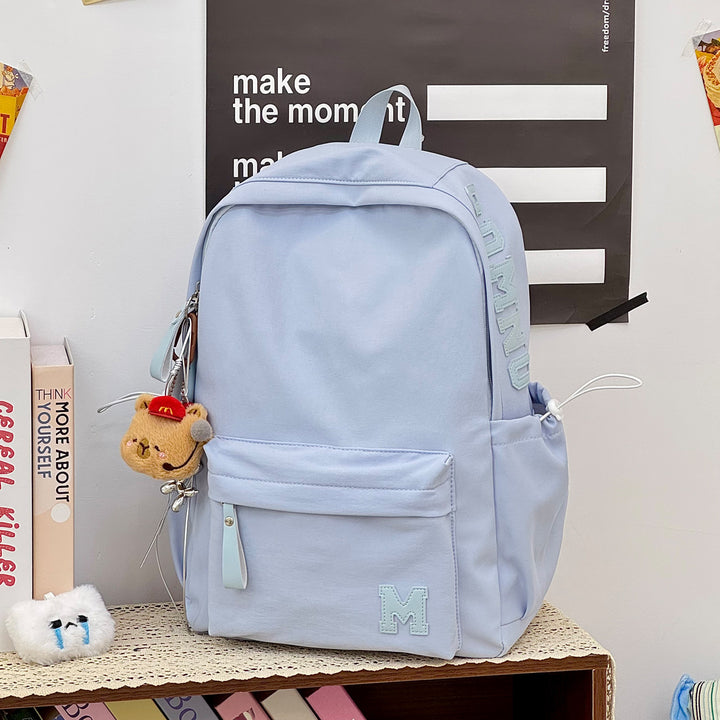 Stylish Canvas Backpack with Plush Keychain Stornfield