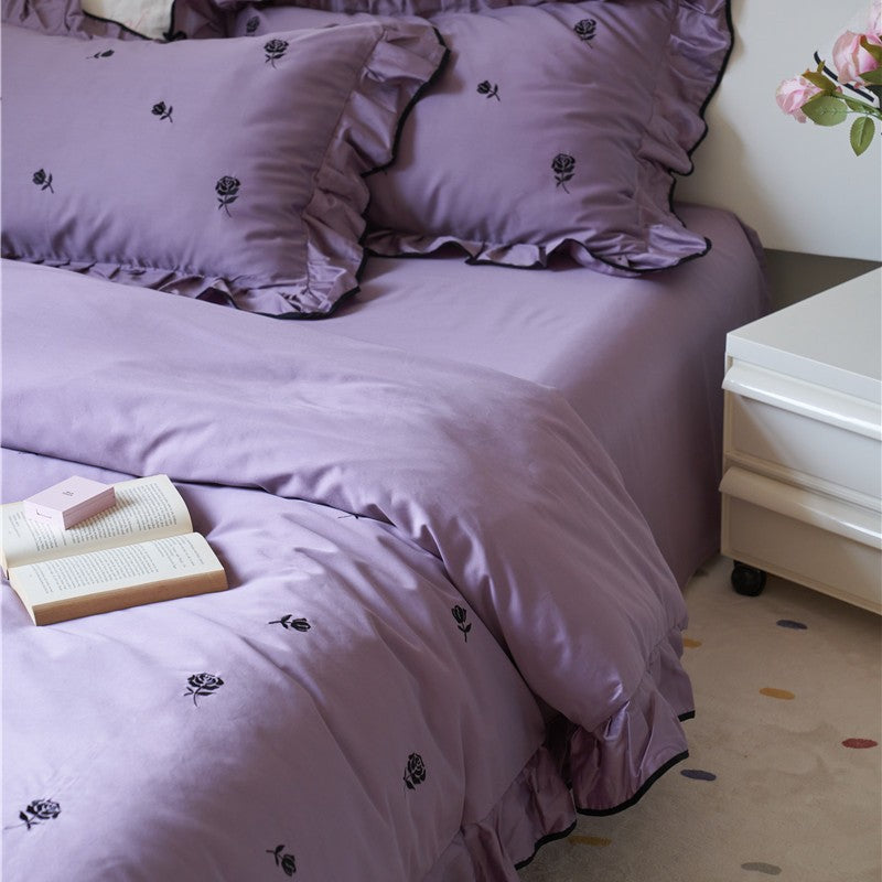 Bedding set with embroidered roses, ruffle details and extra soft cotton satin