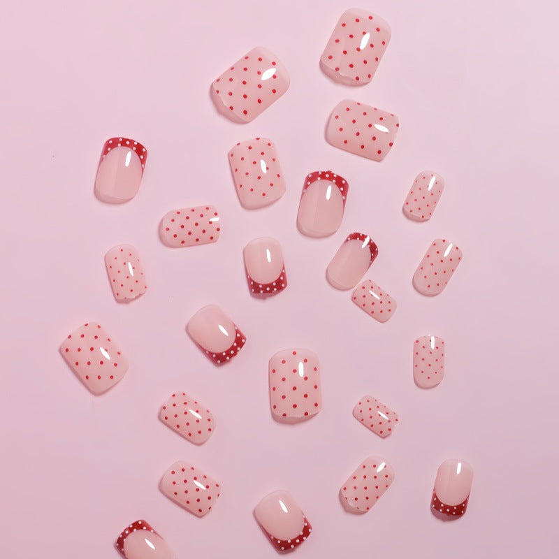 Stylish Press-On Nail Design with Polka Dot and French Tip Accents Stornfield
