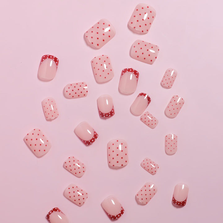 Stylish Press-On Nail Design with Polka Dot and French Tip Accents Stornfield