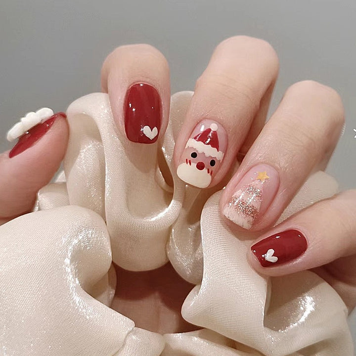 Artificial nail set with festive Christmas motifs and glitter accents Stornfield