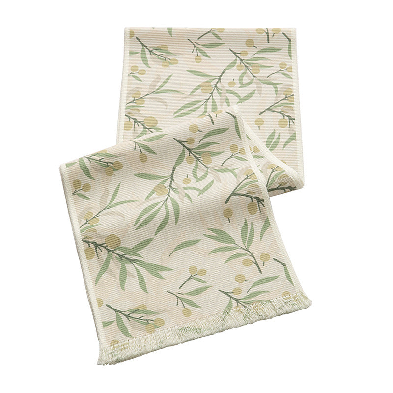 Woven table runner with floral jacquard pattern and fringed edge Stornfield