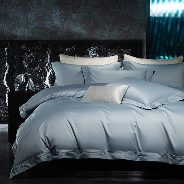 Exclusive cotton satin bedding set with a silky touch, double seam piping, and hotel closure