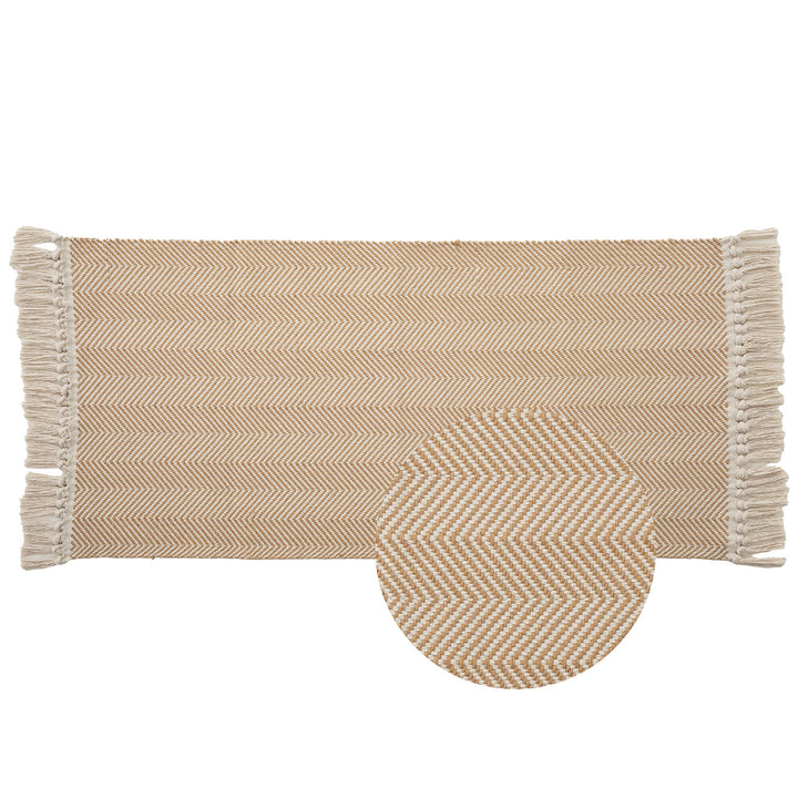 Handwoven runner rug with chevron weave and long fringes