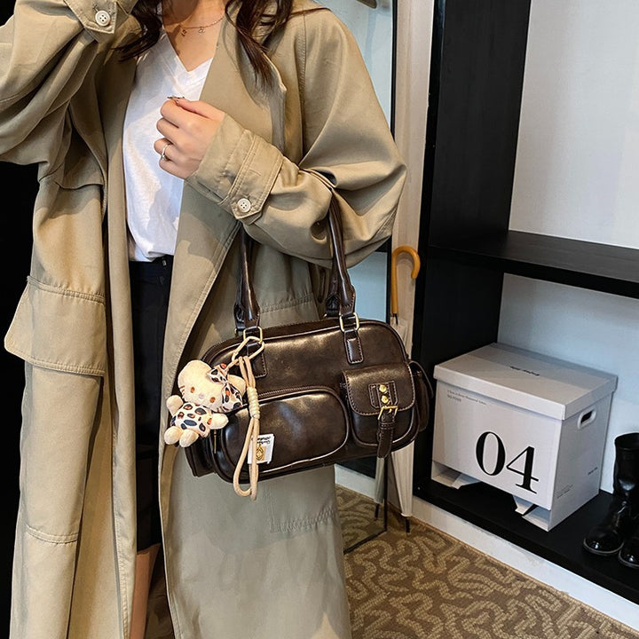 Elegant Handbag with Playful Charms and Multiple Compartments Stornfield