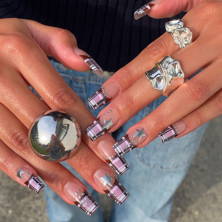 Artificial nails in modern check pattern with glitter and star details Stornfield