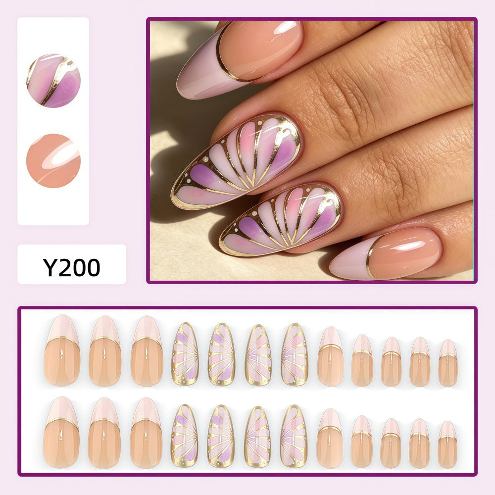 Artificial nails with luxurious gold edge and filigree design Stornfield