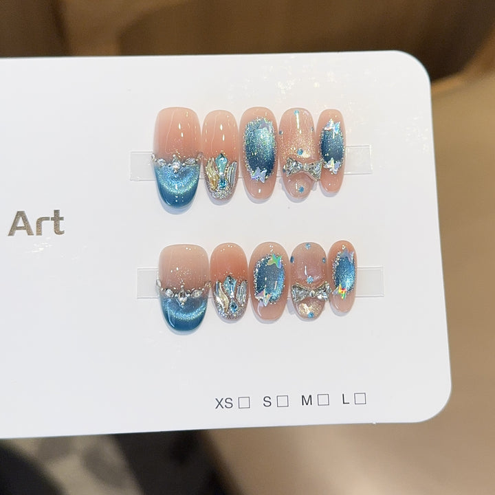 Artificial nail tips with glitter and watercolor effect Stornfield