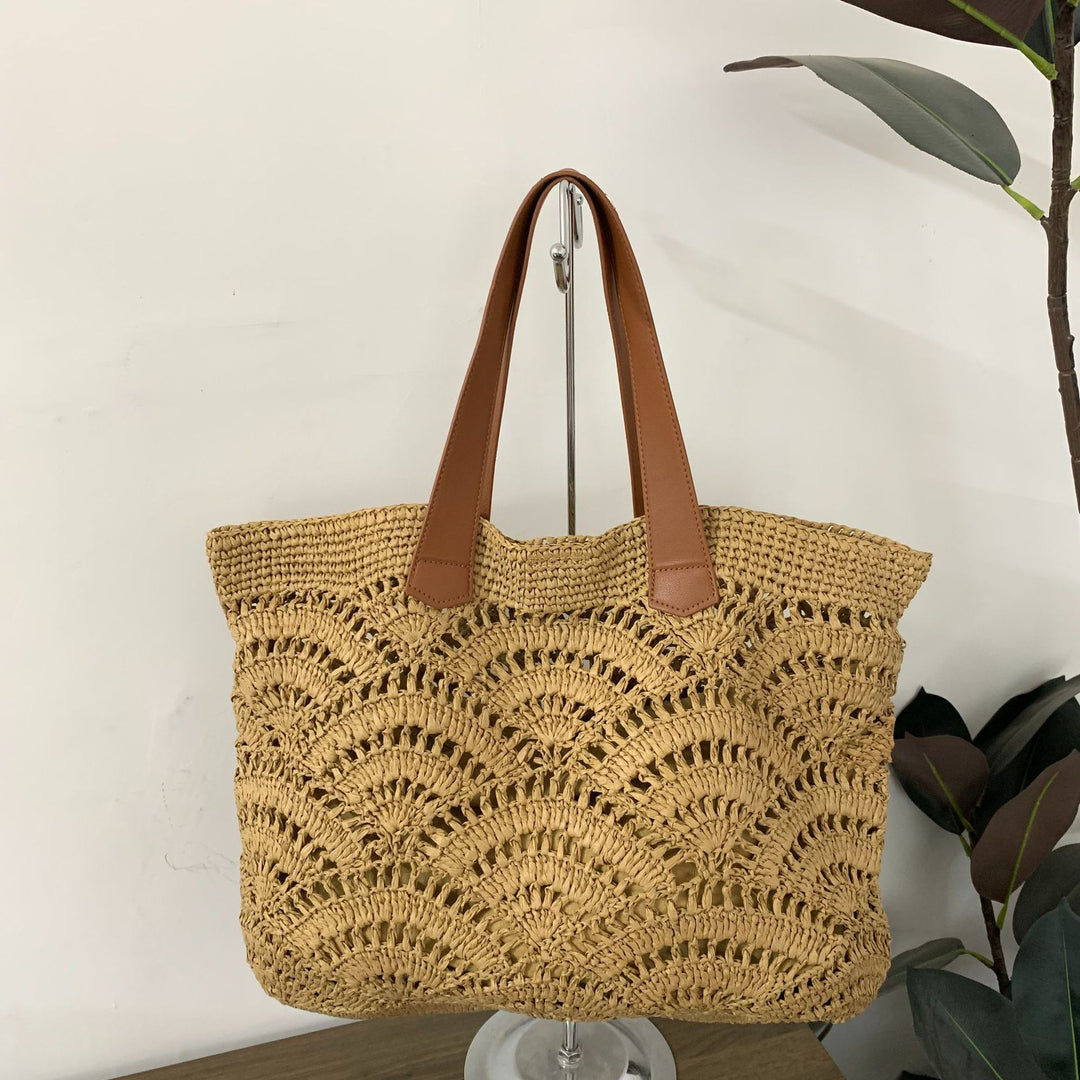 Handbag made of high-quality woven natural material with elegant leather handles Stornfield