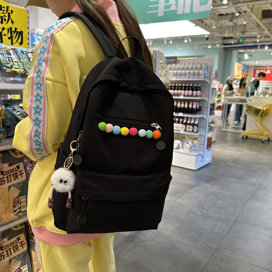 Practical backpack with colorful applications Stornfield