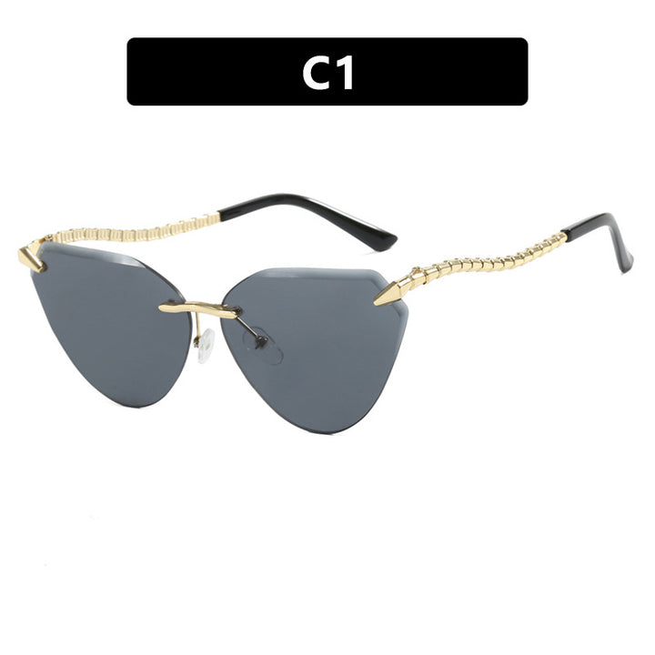 Women's Cat-Eye Sunglasses with unique gold frame design and protective lenses Stornfield